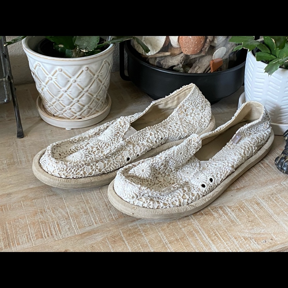 Off white lace slip on Sanuk shoes